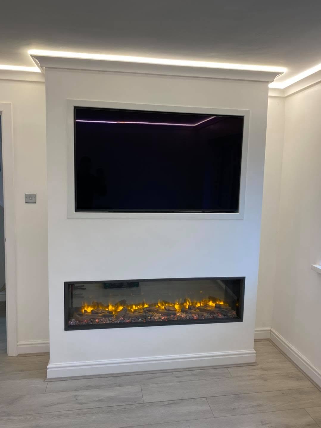 Bespoke media wall with recessed TV, electric fire and cove lighting